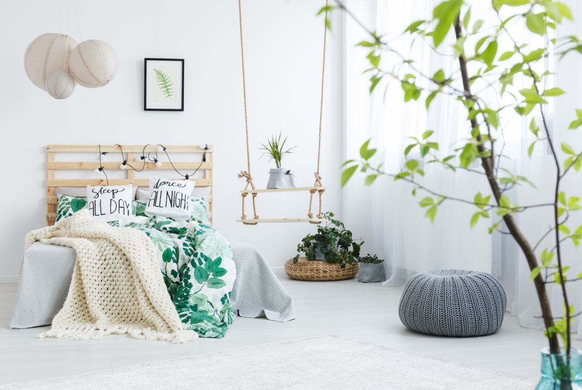 bedroom with gray pouf